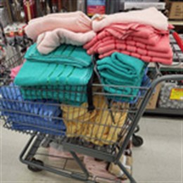 A cart load of NEW towels made possible by donations